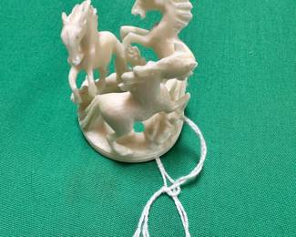 #119 - $40 - Hand carved horses in a circle