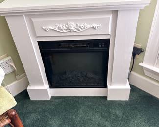 #74 - $70 - Plug in fireplace - heater 32wx9dx30t
