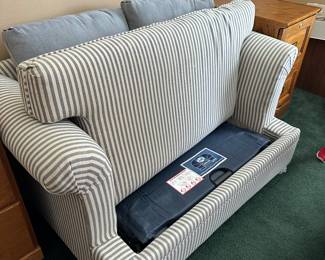 #80 - $200 - Blue striped hideaway (twin) bed with matching ottoman Sealy 48wx32dx23t