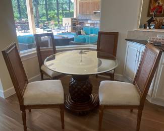 42” beveled glass table w pineapple base, 4 cane back chairs with nailhead accents by Frontgate