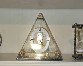 large selection of collectibles includes wood, glass flowers, and porcelain