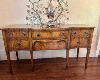 Another antique flame mahogany serpentine sideboard