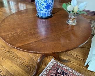 Oak tilt-top table 29"h x 36" diameter
