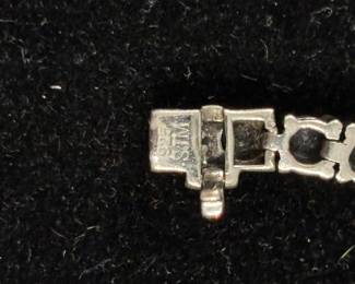 Signed SJM gemstone, tennis bracelet.