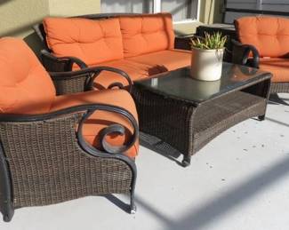 4 Piece Brown Faux Wicker Patio Set, Love Seat, 2 Armchair & Coffee Table.  Two Brown Patio Garden/Pool Storage Trunks  