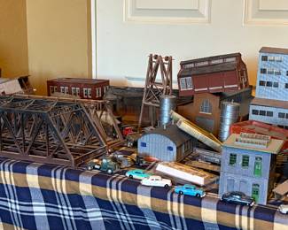 Small town/village with cars, trucks, mini people. Too much to list/photograph. We also have 2 boxes full of more pieces, supplies.