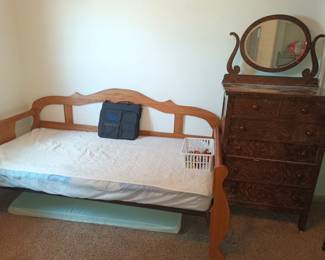 Daybed and and antique bureau. Not one of the 3 letter Bureaus from the government, this one has 5 drawers
