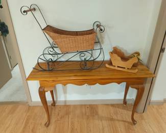 Sofa table and Sleighs.