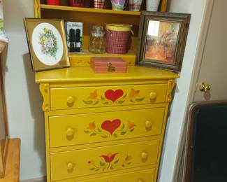 Chest of drawers with flower decor and bookshelf