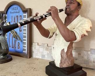 Clarinet Player - 15" tall. Two fingers on right hand broken.