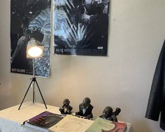 Music books. Posters....Dizzy Gillespie and Billie Holliday; table lamp