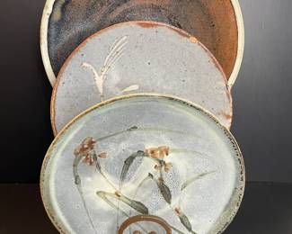 Collection of glazed pottery plates & bowls