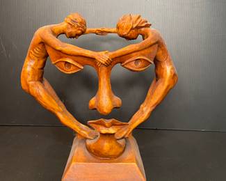 Wood sculpture is titled "We Two Together" by Michael Alfano
