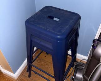2 dark blue metal stools