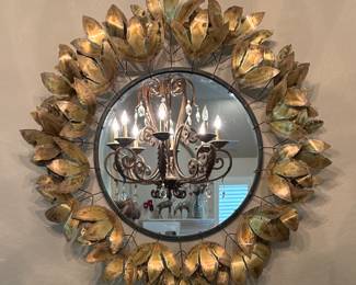 Bring nature indoors with this beautiful metal leaf mirror.