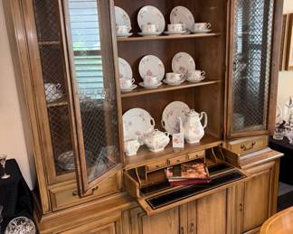 china cabinet. The middle drawer on this very special piece pulls out and drops down to make a small writing desk complete with leather writing surface and cubbyholes.
