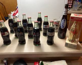Vintage coke bottles. All unopened. Olympics, Superbowls, Christmas, and NBA. Also Coors Light 18 Limited Edition Unopened Baseball Bat Bottle