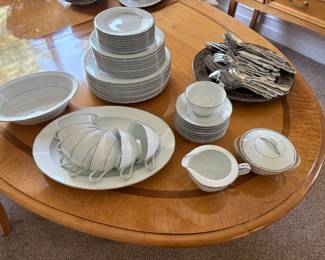 "Buckingham" pattern of Noritake China and Waterford 18/10 stainless flatware