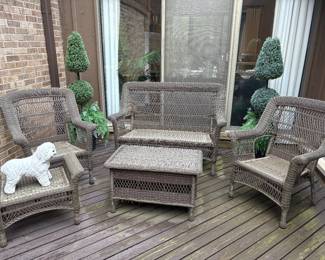All-season wicker furniture (with white cushions - not shown here): loveseat, 2 armchairs, 1 ottoman, cocktail table, and 2 topiaries