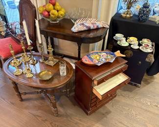 Apothecary chest, side tables, Asian chest, console tables, brass candle holders, and Shelly floral cup/saucer with other English tea cups