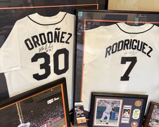 Ordonez and Rodriguez signed jerseys and other baseball memorabilia.