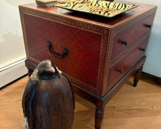 Leather covered legged side table with 2 drawers, wood carved penguin, hand-carved wood vase, copper and stone sculpture and glass platter