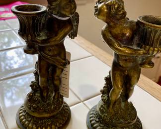 Pair of French Louis XV bronze candlesticks, girl and boy cherubs, throwing a kiss,