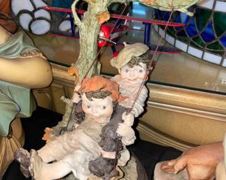 Figurine On Wooden Base