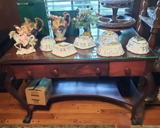 Very heavy mahogany table with glass top and drawers