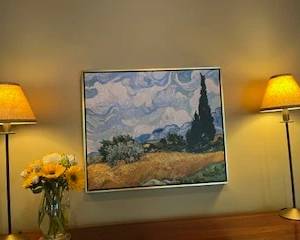 Framed art and pair of lamps.