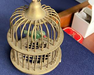 Brass cage with bird