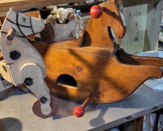Folk art horse rolling made by our neighbor Bud McCann.  Also toy rocking horse