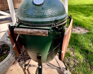 Green Egg smokers w/fold down trays on each side and w/canvas cover