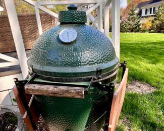 Green Egg smokers w/fold down trays on each side and w/canvas cover