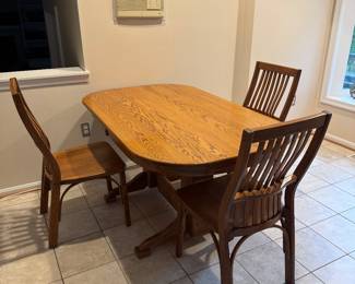 Oak Pedestal Dining Table (60"W x 30"H x 36"D) with 3 Side Chairs
