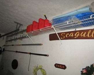 seagull sign, gas cans and hand tools