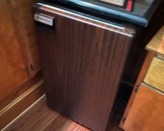 Retro Coldspot mini fridge with faux wood panel design. Compact and functional β perfect for mancave or retro-themed space.