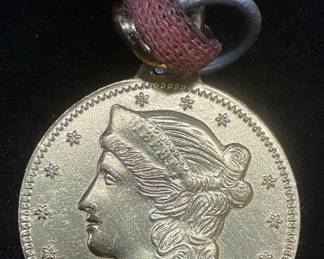Gold Tone Coin Motif Pendant Necklace