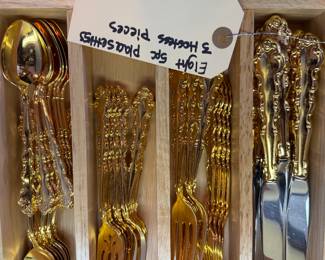 eight place setting s gold flatware