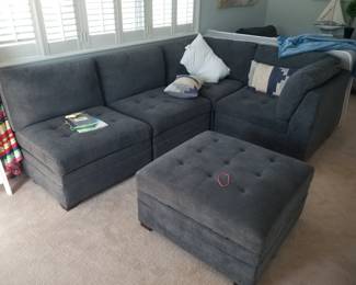 Contemporary gray sectional sofa with storage ottoman