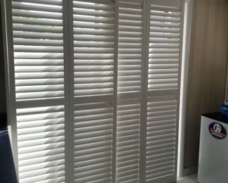 Plantation shutters for sliding glass doors