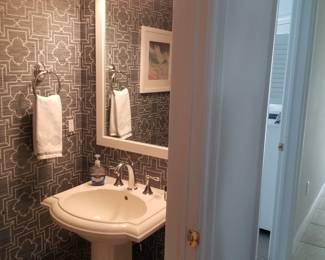 Kohler pedestal sink; wall mirror; vanity lights