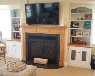 Flat screen TV with wall mount; fireplace mantel