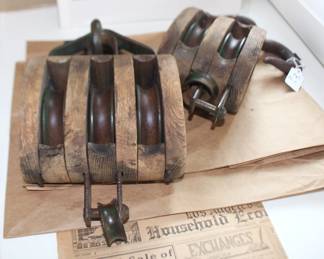 Pair of vintage wooden pulleys.