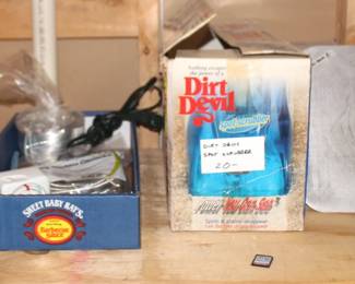 Dirt devil vacuum, drywall mud hawk.