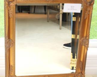Gold frame mirror. 25 1/2" W x 29 1/2" H.
