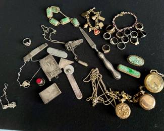 Many pieces of gold jewelry, gold charm bracelet, gold pocket watches