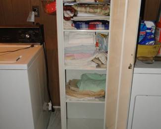 We have plenty of towels and other items as well, enclosed in this solid metal vintage cabinet
