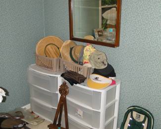 Because sometimes, when you combine, a vintage mirror and lots of hats with plastic rolling drawers, you have an eclectic look, especially when combined with a hand carved pedestal stand