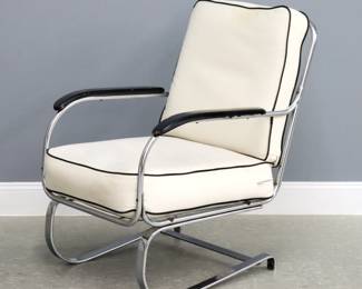A 1930's Art Deco Period Kem Weber for Lloyd "Springer" lounge chair. Chrome tube frame with lift-off upholstered cushions, open arms and painted wood armrests on a flat bar cantilever base. Newer canvas upholstery, repainted armrests with some wear, slight oxidation to chrome. 24 x 30 x 36" high overall.